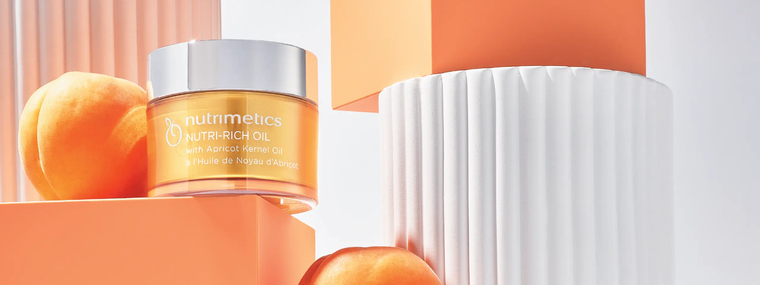 Nutri-Rich Oil with apricots on white pillar