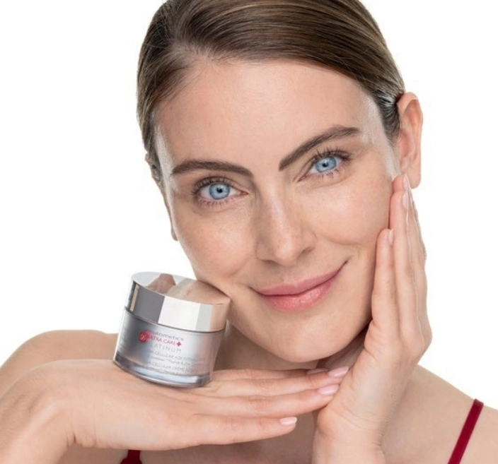 platinum model holding DNA cream